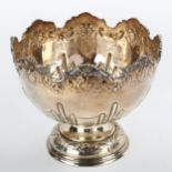 A small Edwardian silver pedestal fruit bowl, relief embossed foliate and fluted decoration, by