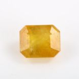 An unmounted 7.63ct octagonal step-cut yellow sapphire, 10.81mm x 8.72mm x 6.78mm, with ITLGR report