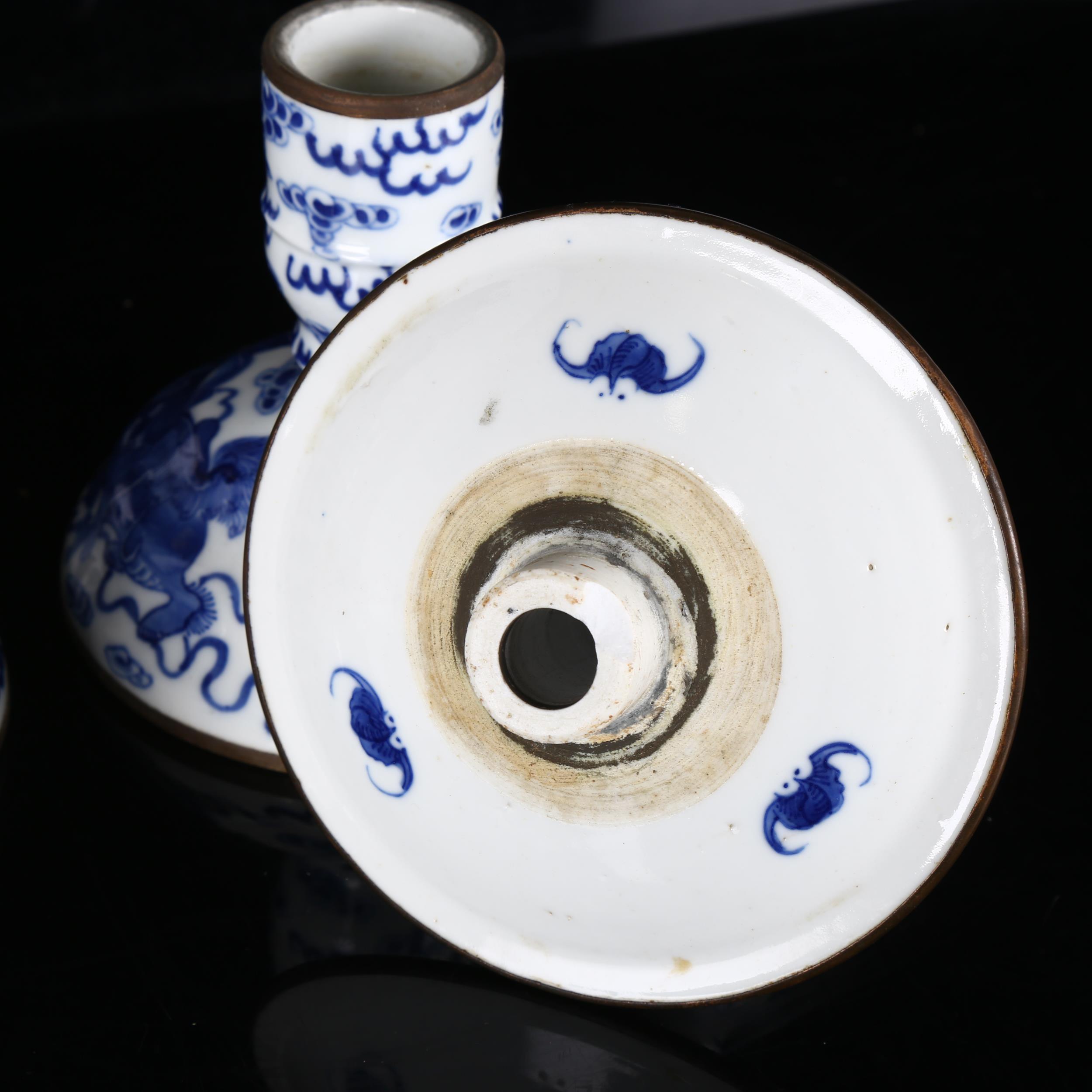 A pair of Chinese blue and white 'Dog of Fo' altar candlesticks, decorated in underglaze blue with - Image 5 of 12