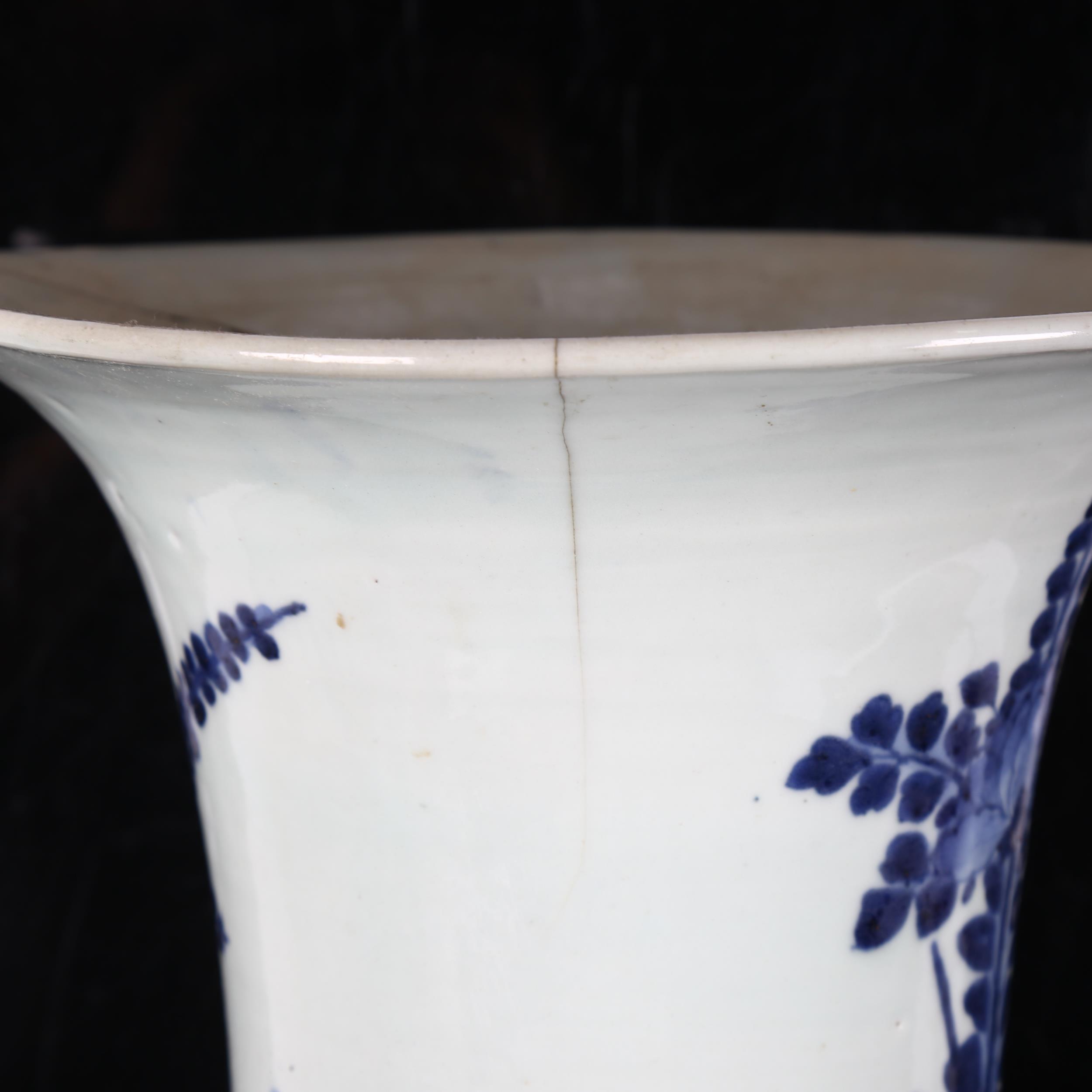 A Chinese blue and white beaker vase, 19th century, decorated in underglaze blue with floral sprays, - Image 5 of 11