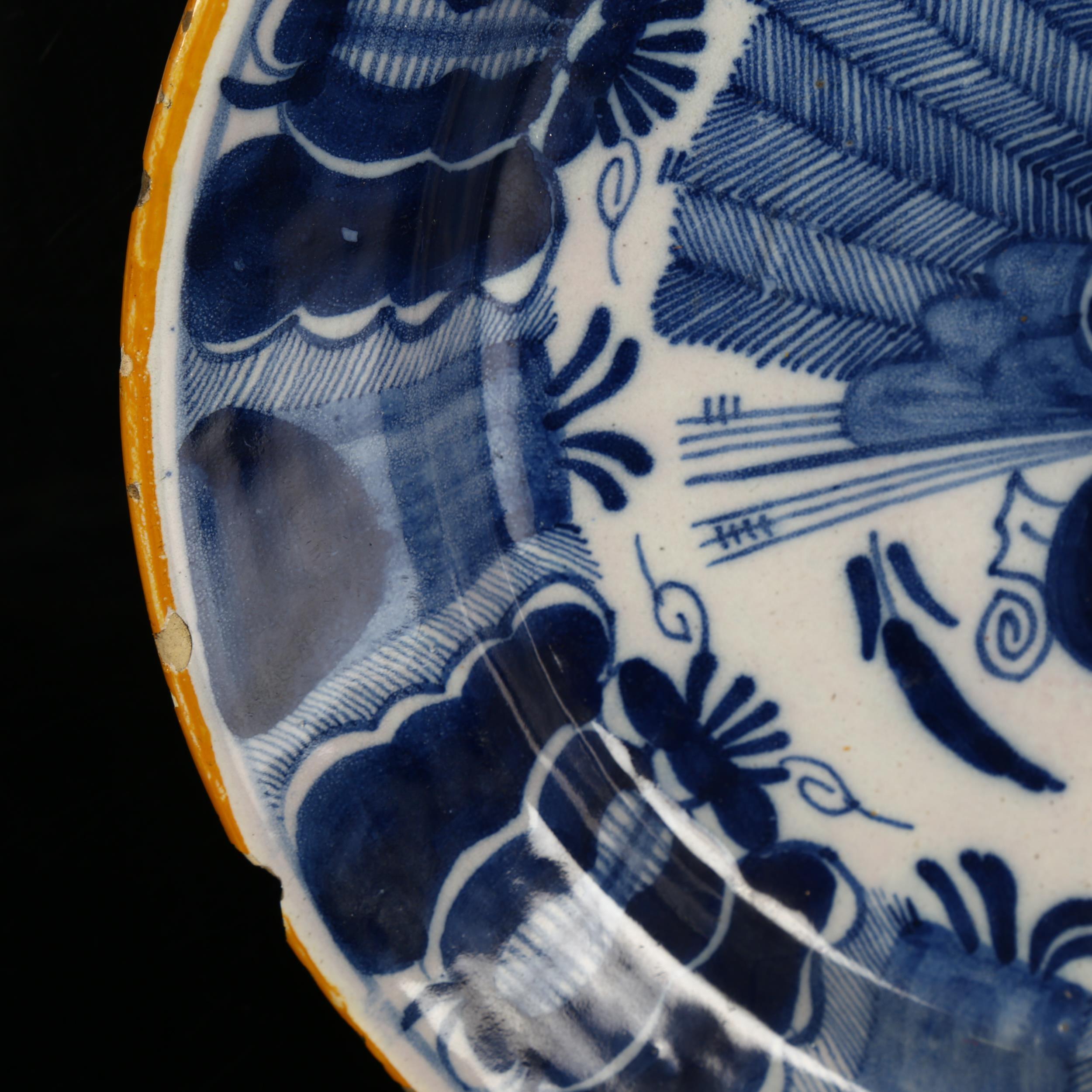 A graduated pair of 18th century Dutch Delft peacock pattern chargers, both marked, diameters 31cm - Image 5 of 19