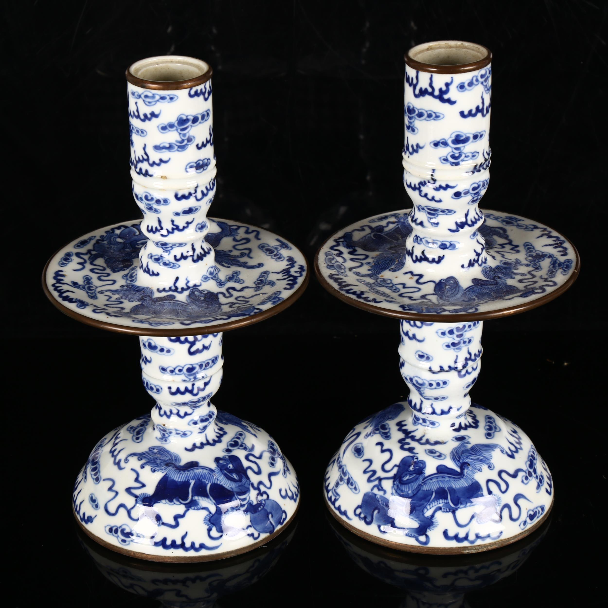 A pair of Chinese blue and white 'Dog of Fo' altar candlesticks, decorated in underglaze blue with - Image 3 of 12