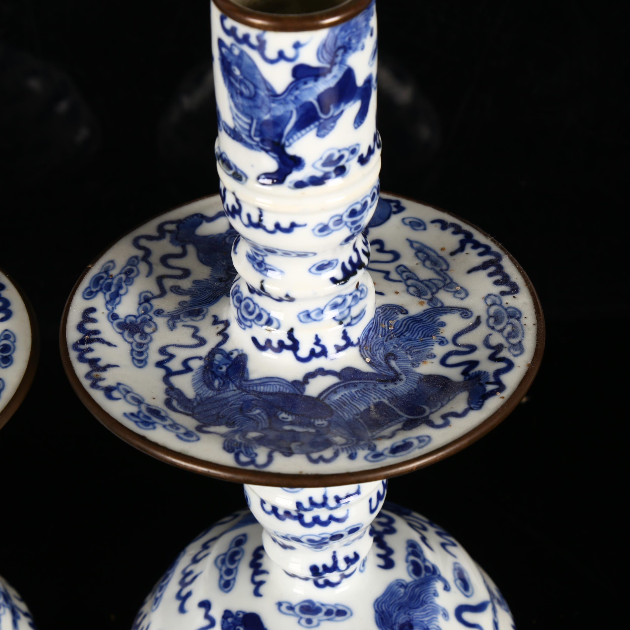 A pair of Chinese blue and white 'Dog of Fo' altar candlesticks, decorated in underglaze blue with - Image 7 of 12