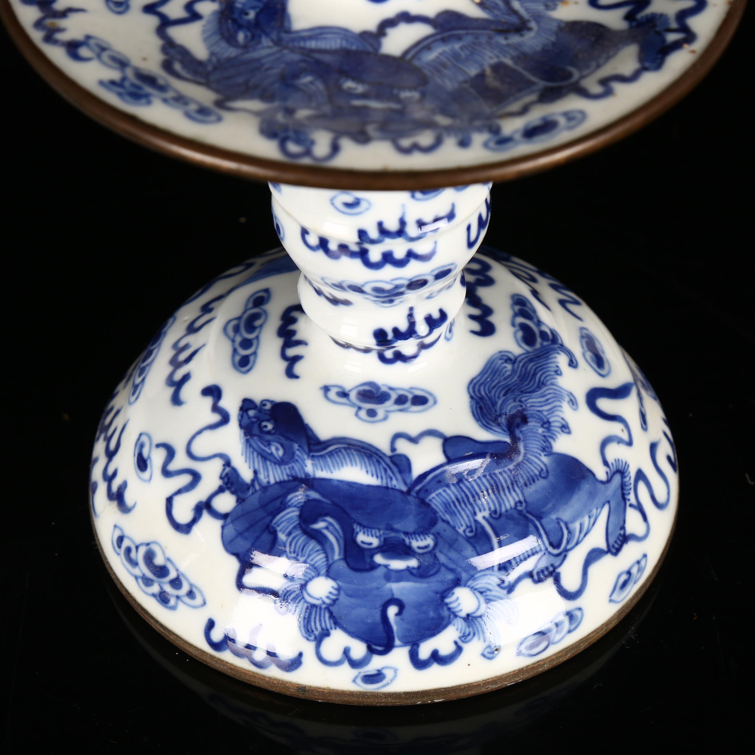 A pair of Chinese blue and white 'Dog of Fo' altar candlesticks, decorated in underglaze blue with - Image 8 of 12