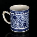 A large Chinese Export blue and white mug, 18th century, decorated in underglaze blue with allover