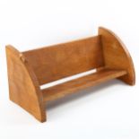 A Robert "Mouseman" Thompson oak book rack, L46cm x D20cm x H20cm Good original condition, age