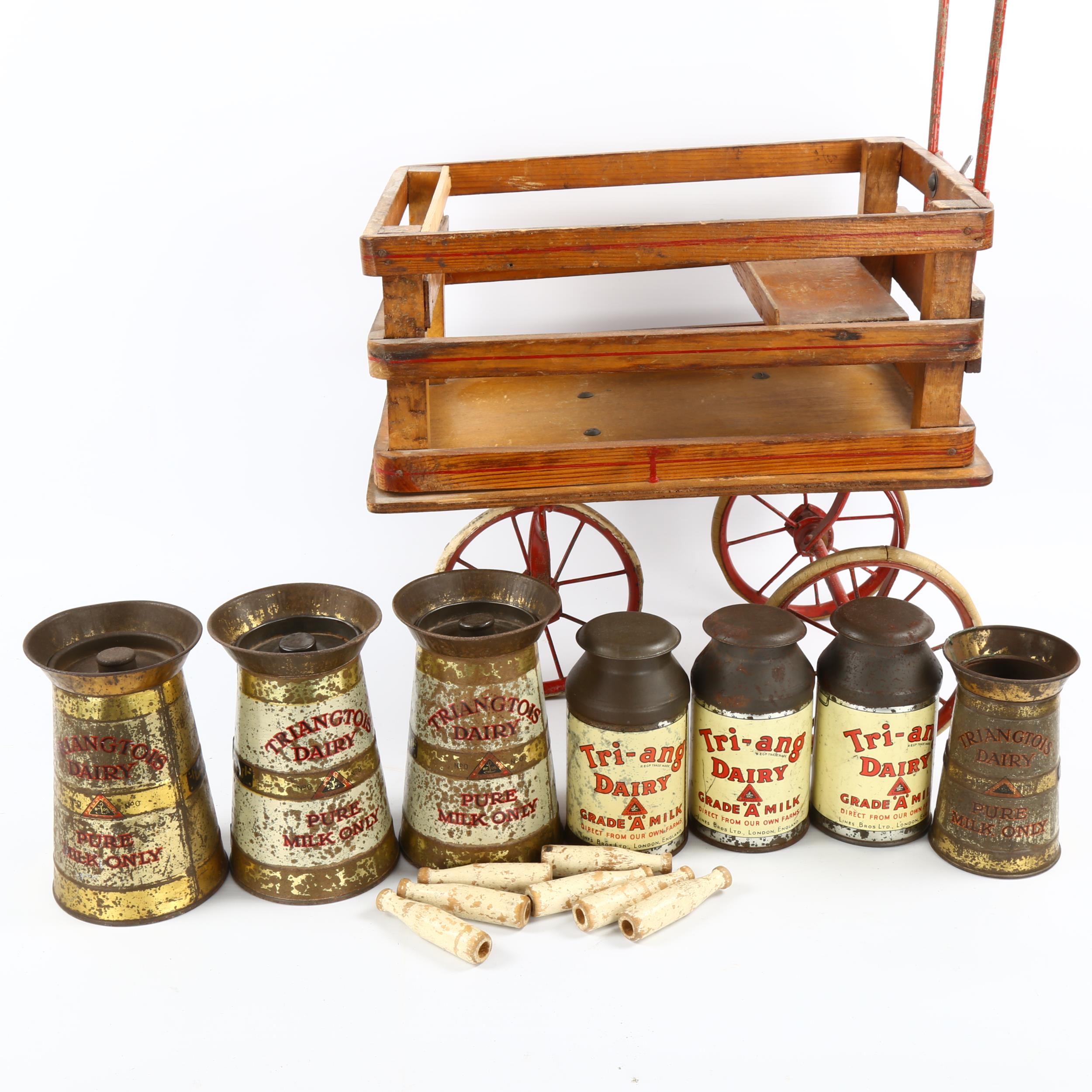 A rare Tri-ang toy milk cart, stained wood and metal, containing original tinplate milk churns and - Image 2 of 3