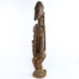 A large African Dogon Tribal carved wood fertility figure, height 90cm A few minor age-related