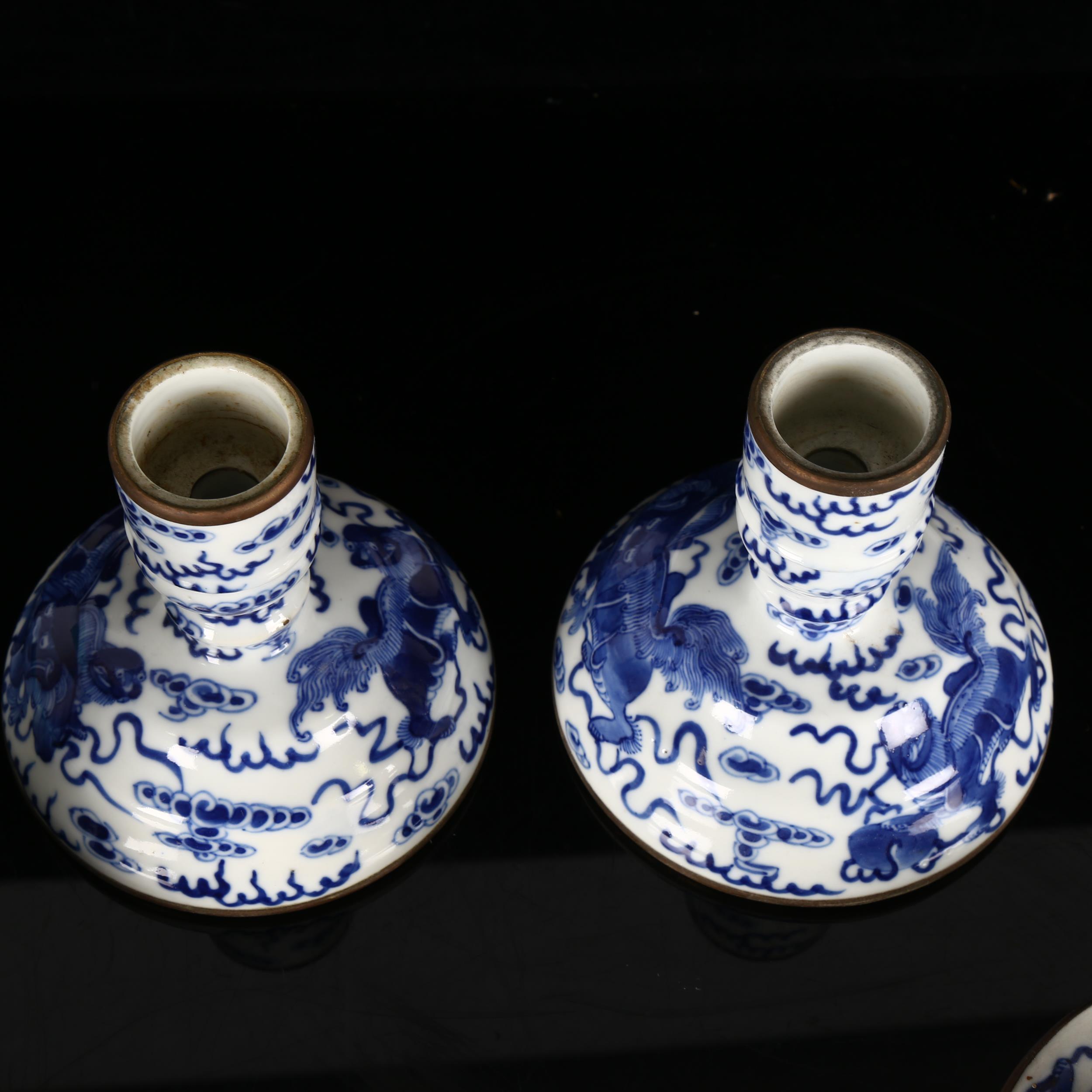 A pair of Chinese blue and white 'Dog of Fo' altar candlesticks, decorated in underglaze blue with - Image 9 of 12