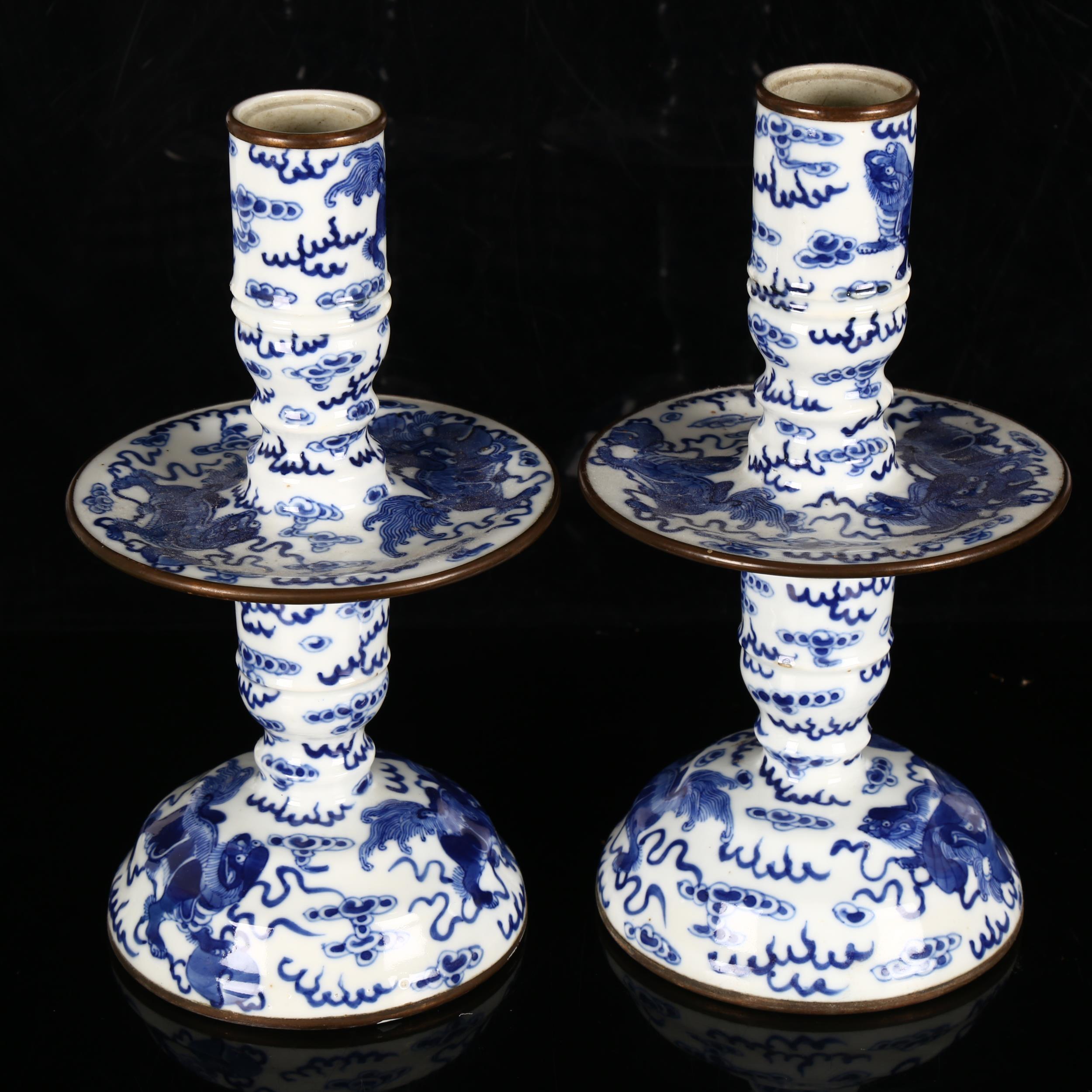 A pair of Chinese blue and white 'Dog of Fo' altar candlesticks, decorated in underglaze blue with - Image 2 of 12