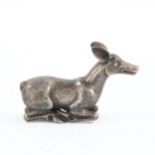Indian unmarked white metal recumbent deer, probably 18th or 19th century, length 10cm,