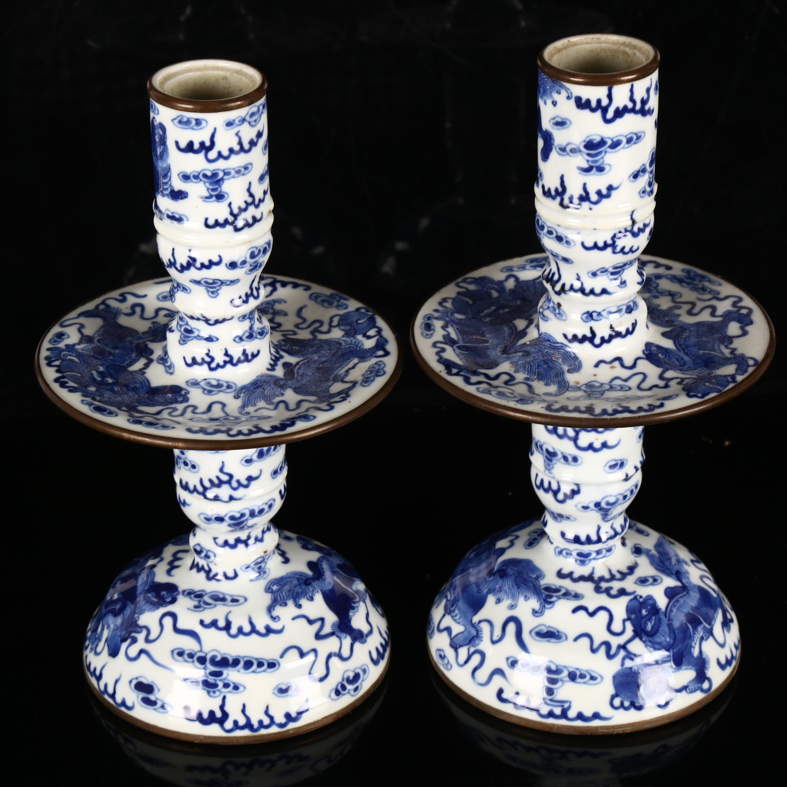 A pair of Chinese blue and white 'Dog of Fo' altar candlesticks, decorated in underglaze blue with - Image 4 of 12