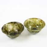 A pair of Chinese Spinach Jade bowls, diameter 10cm