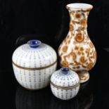 A graduated pair of Chinese blue and white porcelain jars and covers, transfer printed text