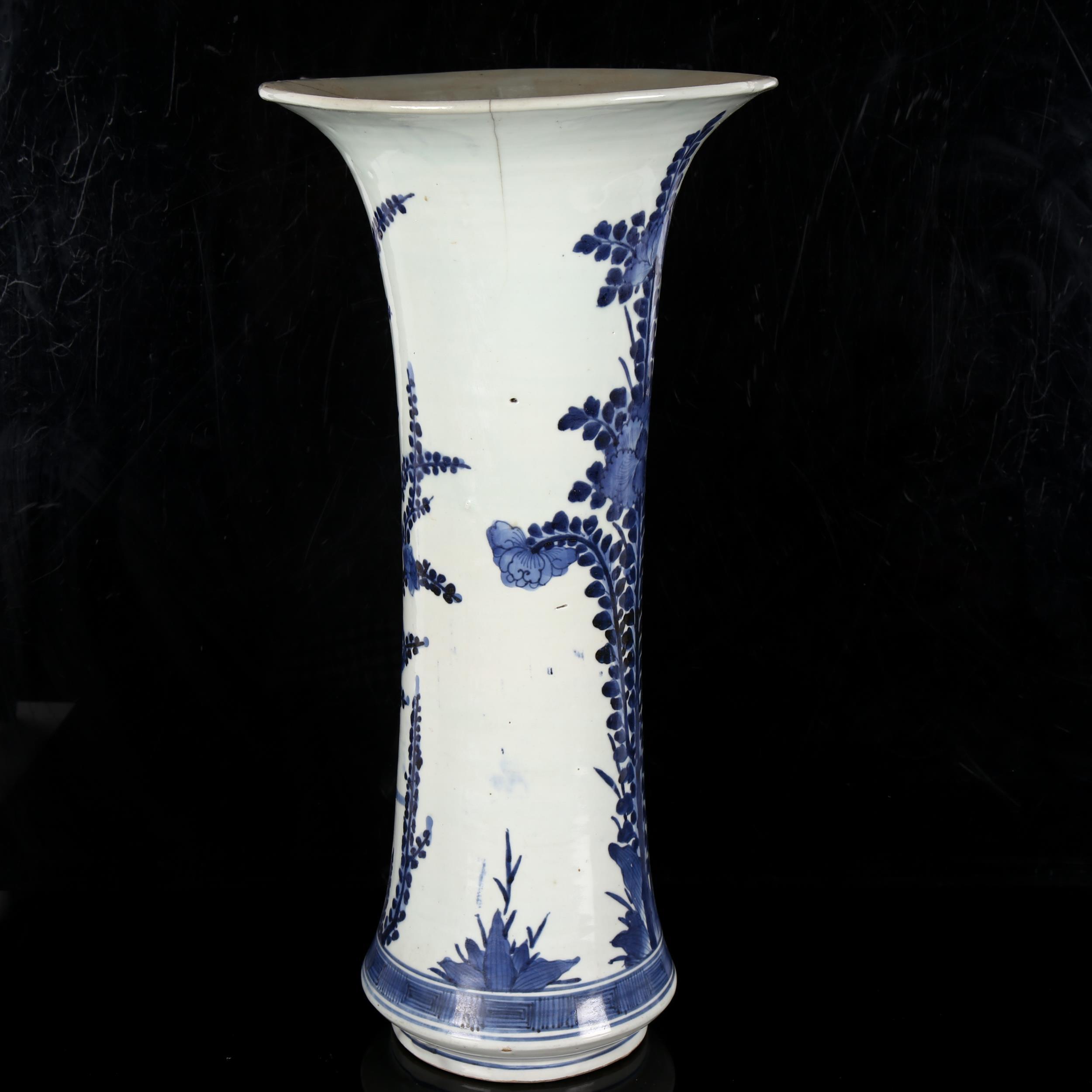 A Chinese blue and white beaker vase, 19th century, decorated in underglaze blue with floral sprays, - Image 4 of 11