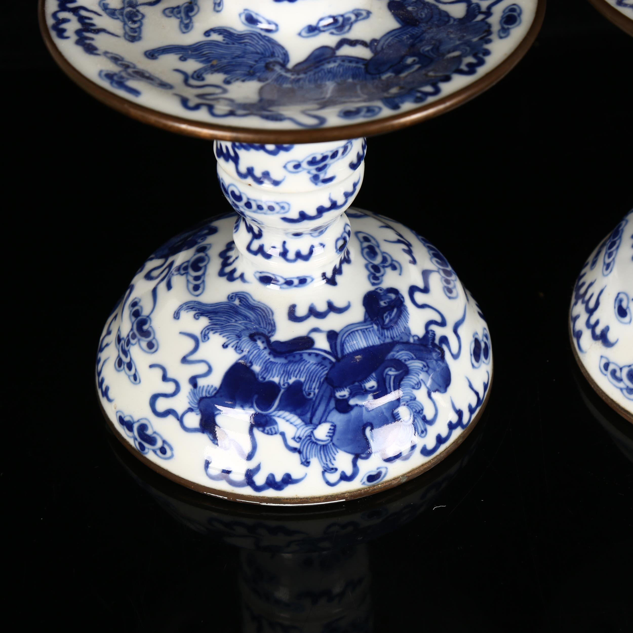 A pair of Chinese blue and white 'Dog of Fo' altar candlesticks, decorated in underglaze blue with - Image 12 of 12