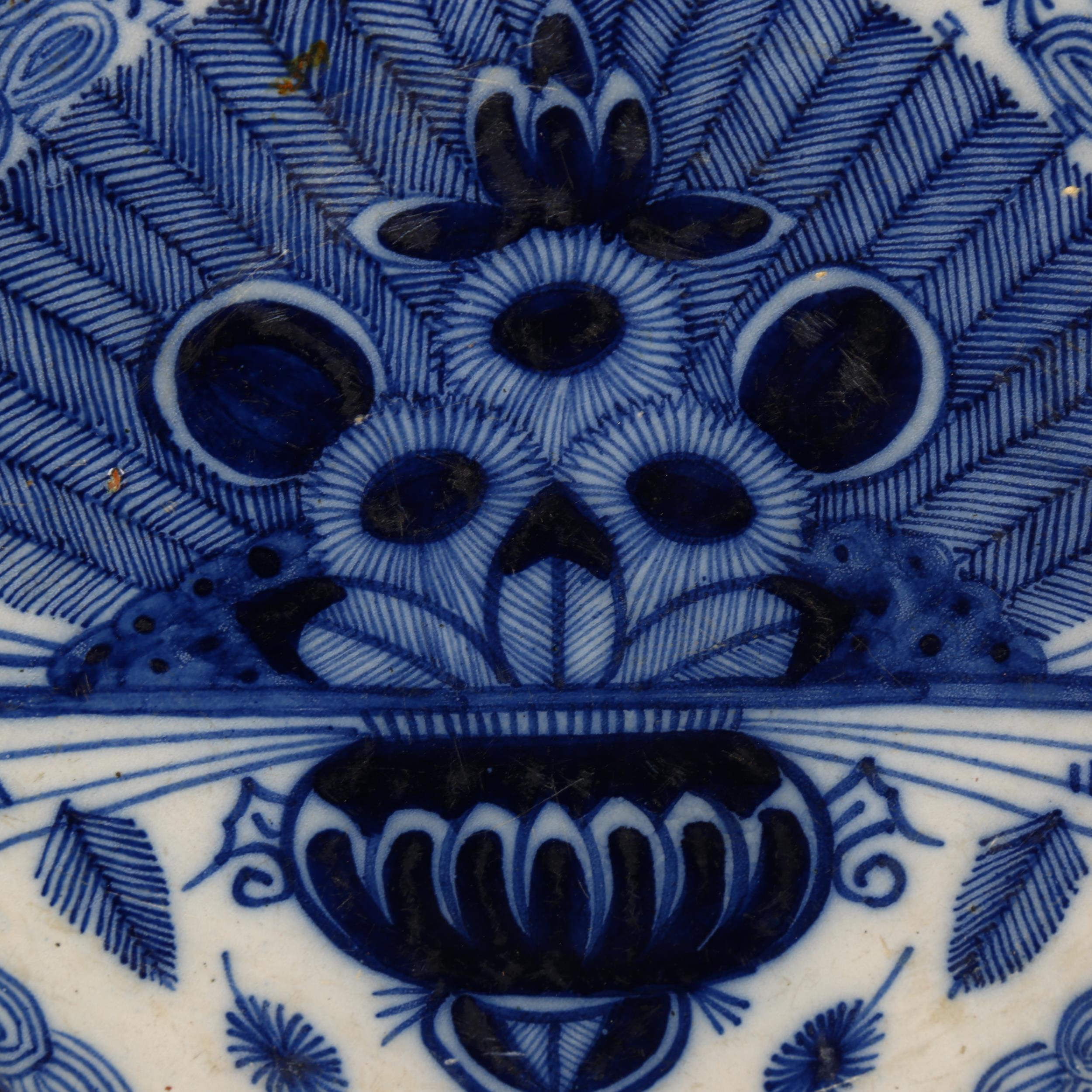 A graduated pair of 18th century Dutch Delft peacock pattern chargers, both marked, diameters 31cm - Image 17 of 19