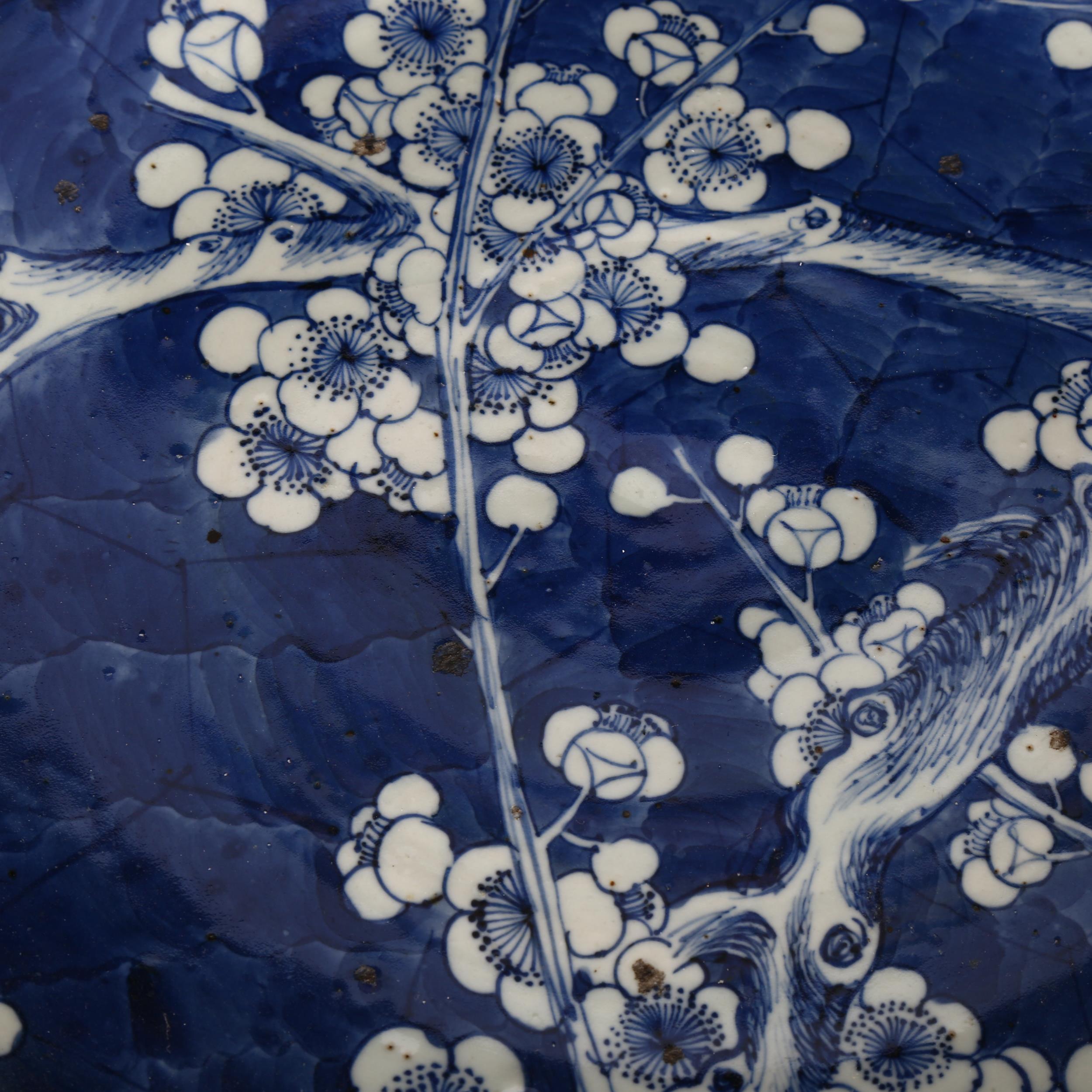 A large Chinese blue and white 'Prunus' charger, 19th century, decorated with underglaze blue, - Image 8 of 8