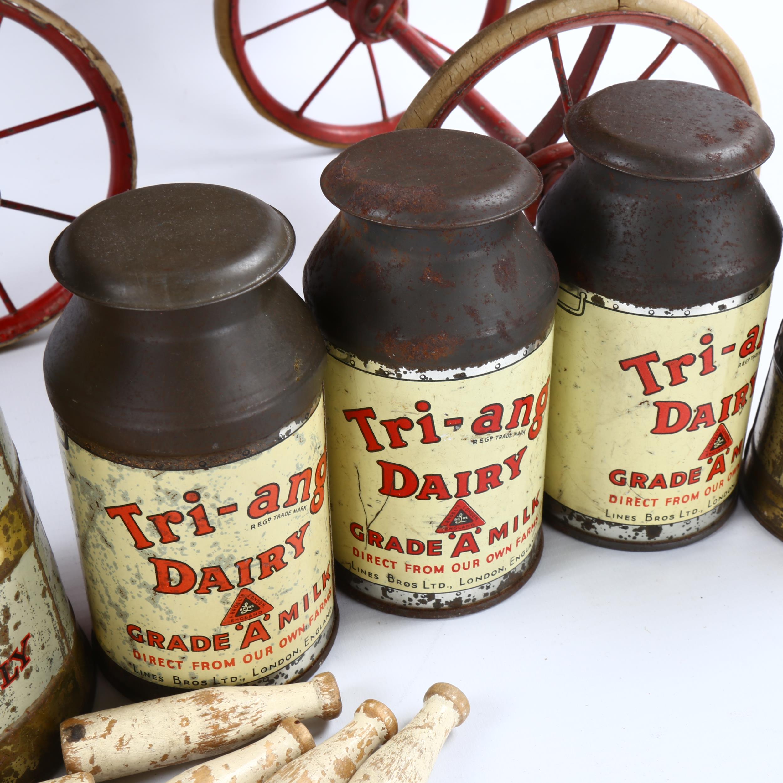 A rare Tri-ang toy milk cart, stained wood and metal, containing original tinplate milk churns and - Image 3 of 3