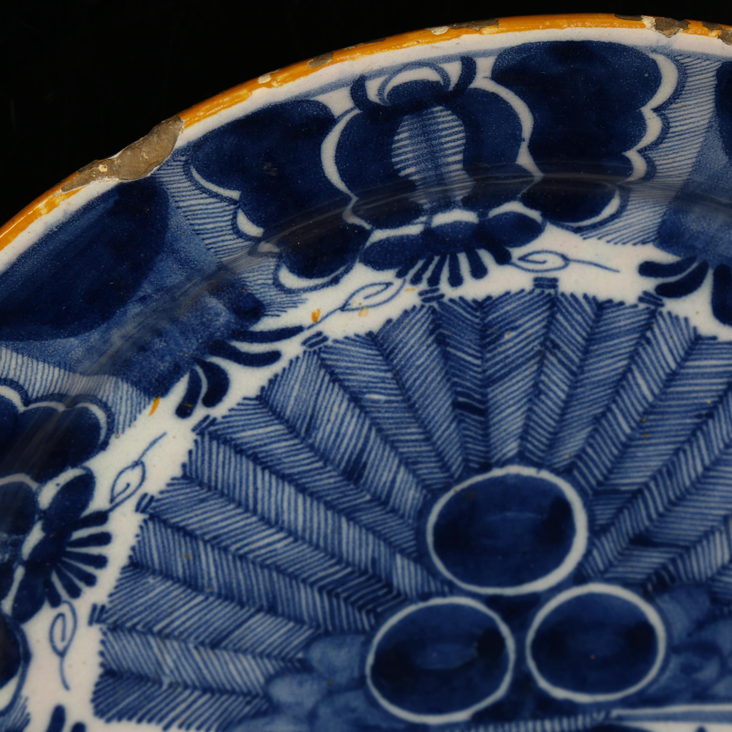 A graduated pair of 18th century Dutch Delft peacock pattern chargers, both marked, diameters 31cm - Image 6 of 19