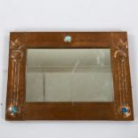 LIBERTY - Art Nouveau copper-framed wall mirror, with relief embossed surround and inset Ruskin