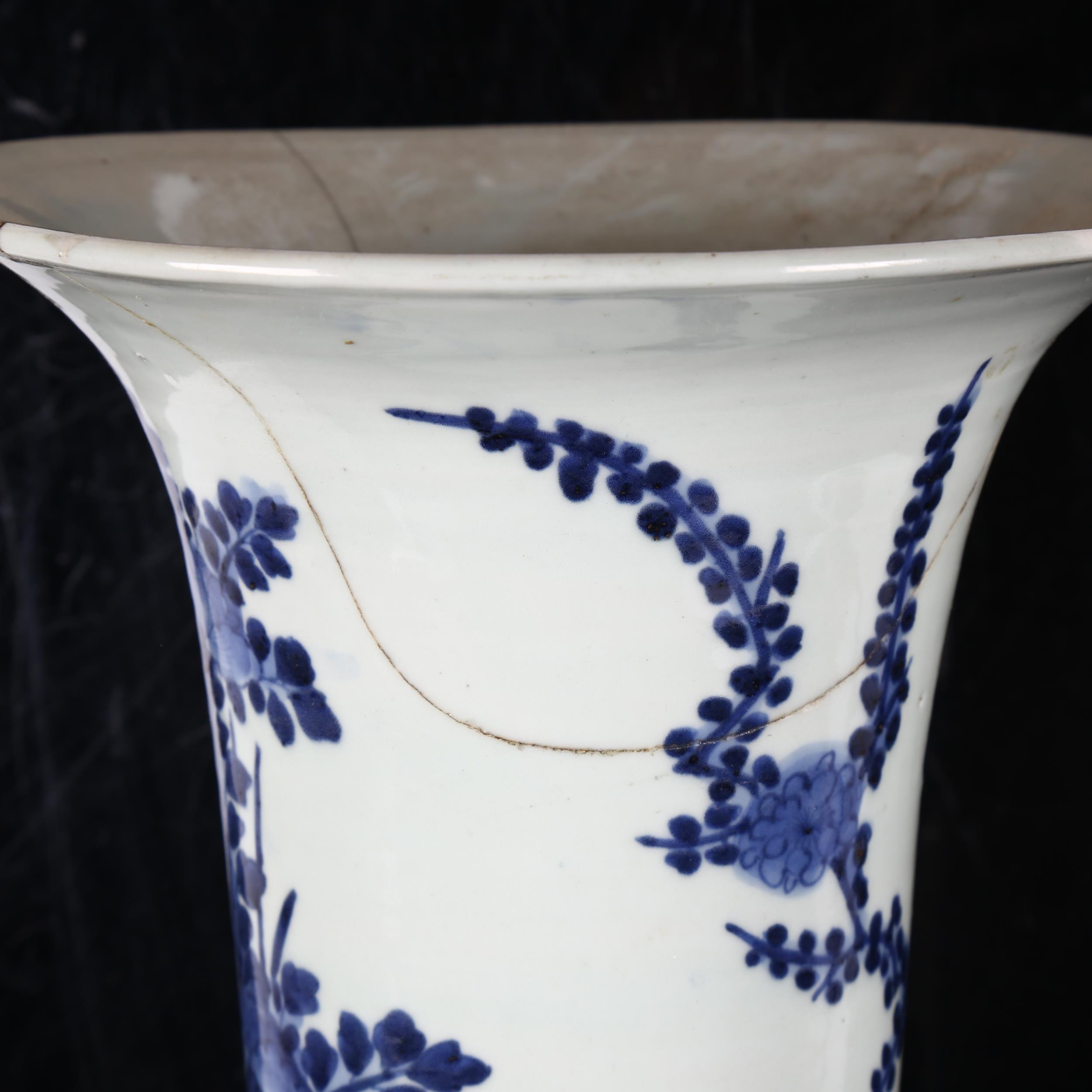 A Chinese blue and white beaker vase, 19th century, decorated in underglaze blue with floral sprays, - Image 6 of 11