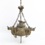 An ornate Chinese patinated bronze hanging incense burner with 3 dragon mask mounts, a dragon