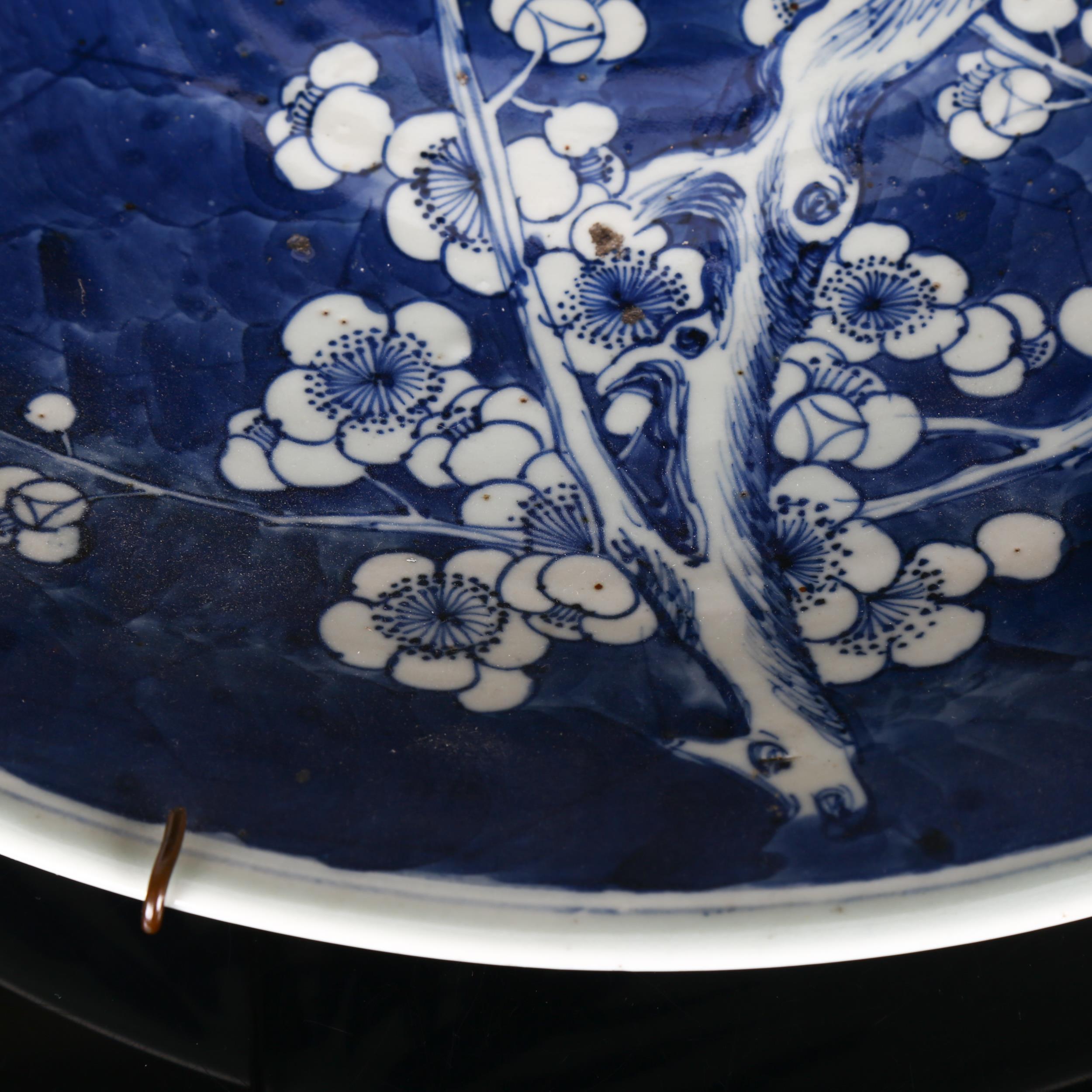 A large Chinese blue and white 'Prunus' charger, 19th century, decorated with underglaze blue, - Image 7 of 8