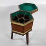 A George III brass-bound mahogany cellarette/wine cooler of hexagonal form, on original mahogany