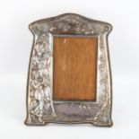 An Art Nouveau electroplate photo frame, relief moulded decoration depicting a woman and child,