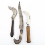 An 18th century Indian/Middle Eastern knife with shaped blade and white metal ram's head handle,