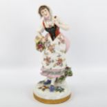 Dresden porcelain figure of a woman with flower basket, height 25cm