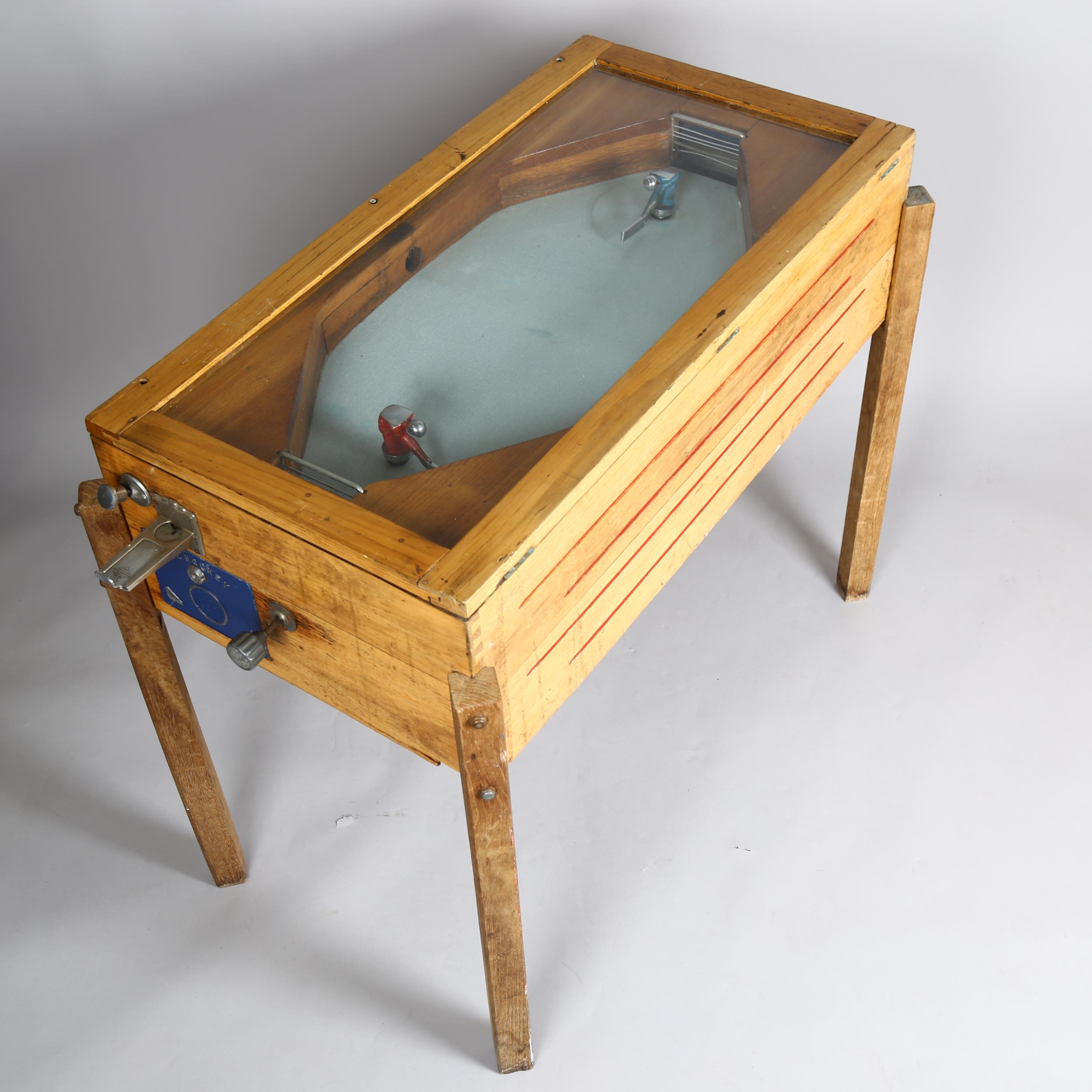 Ruffler & Walker ice hockey amusement arcade machine circa 1950, oak case, operating on an old