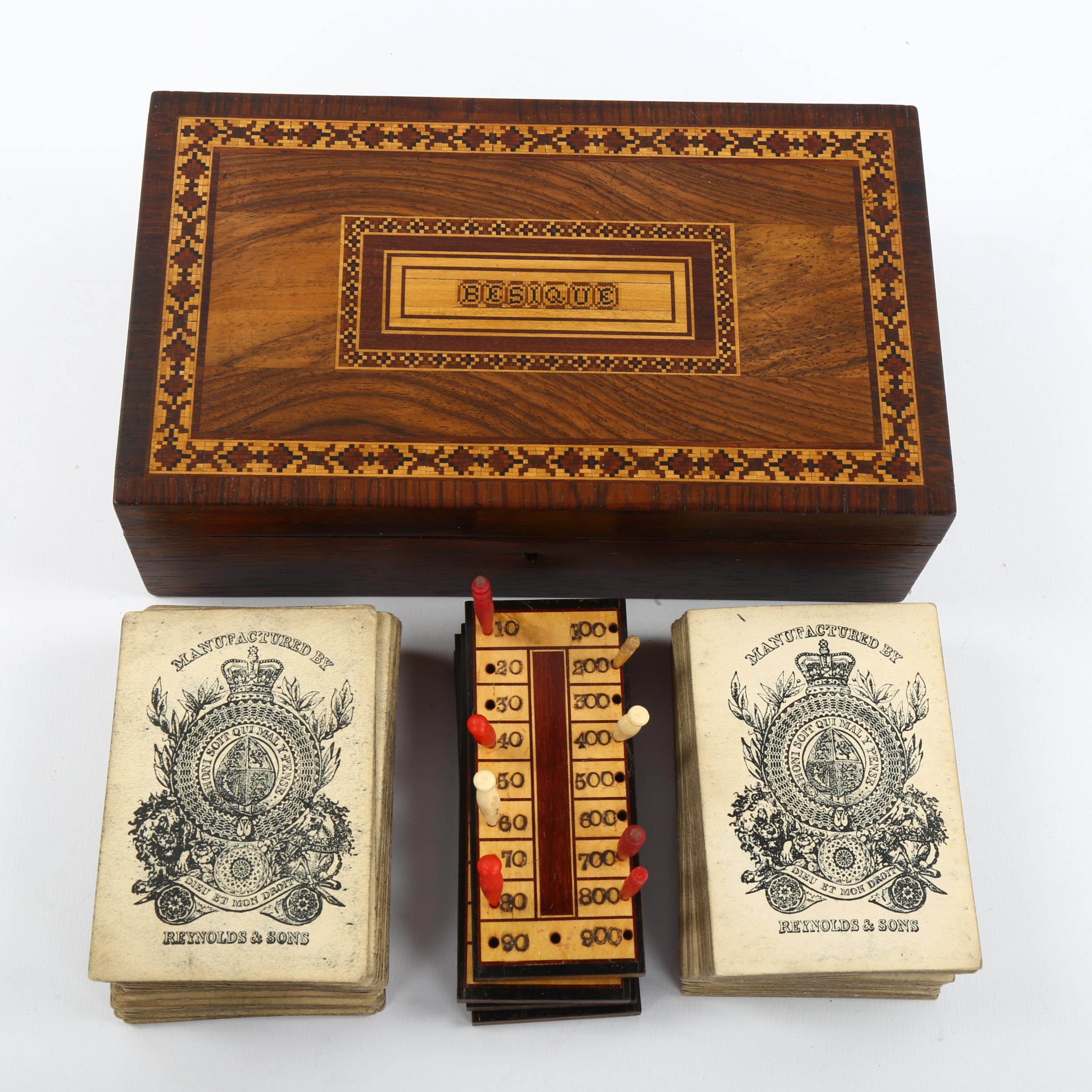 A Tunbridge Ware besique rosewood and parquetry inlaid games box, the interior fitted with cards and