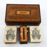 A Tunbridge Ware besique rosewood and parquetry inlaid games box, the interior fitted with cards and