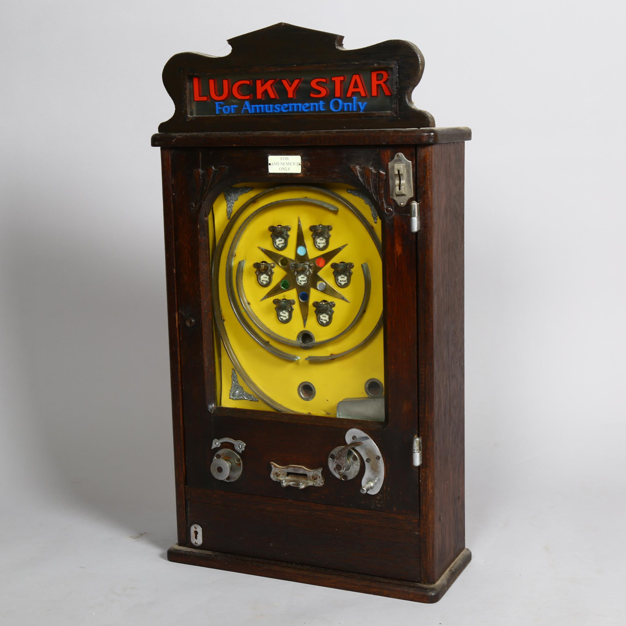 Lucky Star flick ball amusement arcade wall machine circa 1920s, stained wood case with original