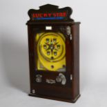 Lucky Star flick ball amusement arcade wall machine circa 1920s, stained wood case with original