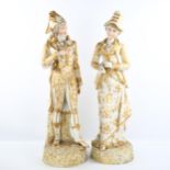 A large pair of 19th century Continental porcelain figures, in painted and gilded dress, factory