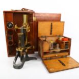 Swift & Son brass-mounted student's microscope, with spare lenses, in original mahogany case with