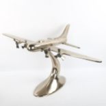 A cast-aluminium desk ornament of a 4-propeller aircraft, wingspan 81cm, length 48cm