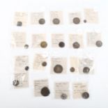 A collection of coins and tokens, including Elizabeth I shilling, Ancient Greek and Roman