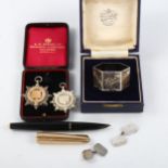Mixed group of items, including Parker fountain pen, 2 silver prize fobs, cased silver napkin