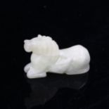 A Chinese pale green jade horse, length 8cm