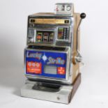 Aristocrat Nevada Lucky Strike one-armed bandit circa 1964, operating on an old shilling, light-up
