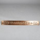 F. W. Woolworth & Co. Limited relief cast-bronze name plaque on bronze brackets, 63.5cm x 7.5cm