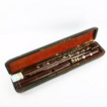 An 19th century Buffet rosewood 3 section flute, in original case, makers stamp on two sections "