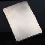 A George VI silver cigarette case, allover engine turned decoration with gilt interior, by E J