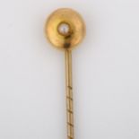 A Victorian 15ct gold split pearl stickpin, head diameter 8mm, overall length 53.4mm, 1.1g Backing