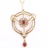 An Edwardian garnet and pearl openwork pendant necklace, unmarked gold settings, on 9ct fine fancy