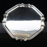 A large George Vi silver salver, square-shaped form with scrolled acanthus leaf feet, by Viner's